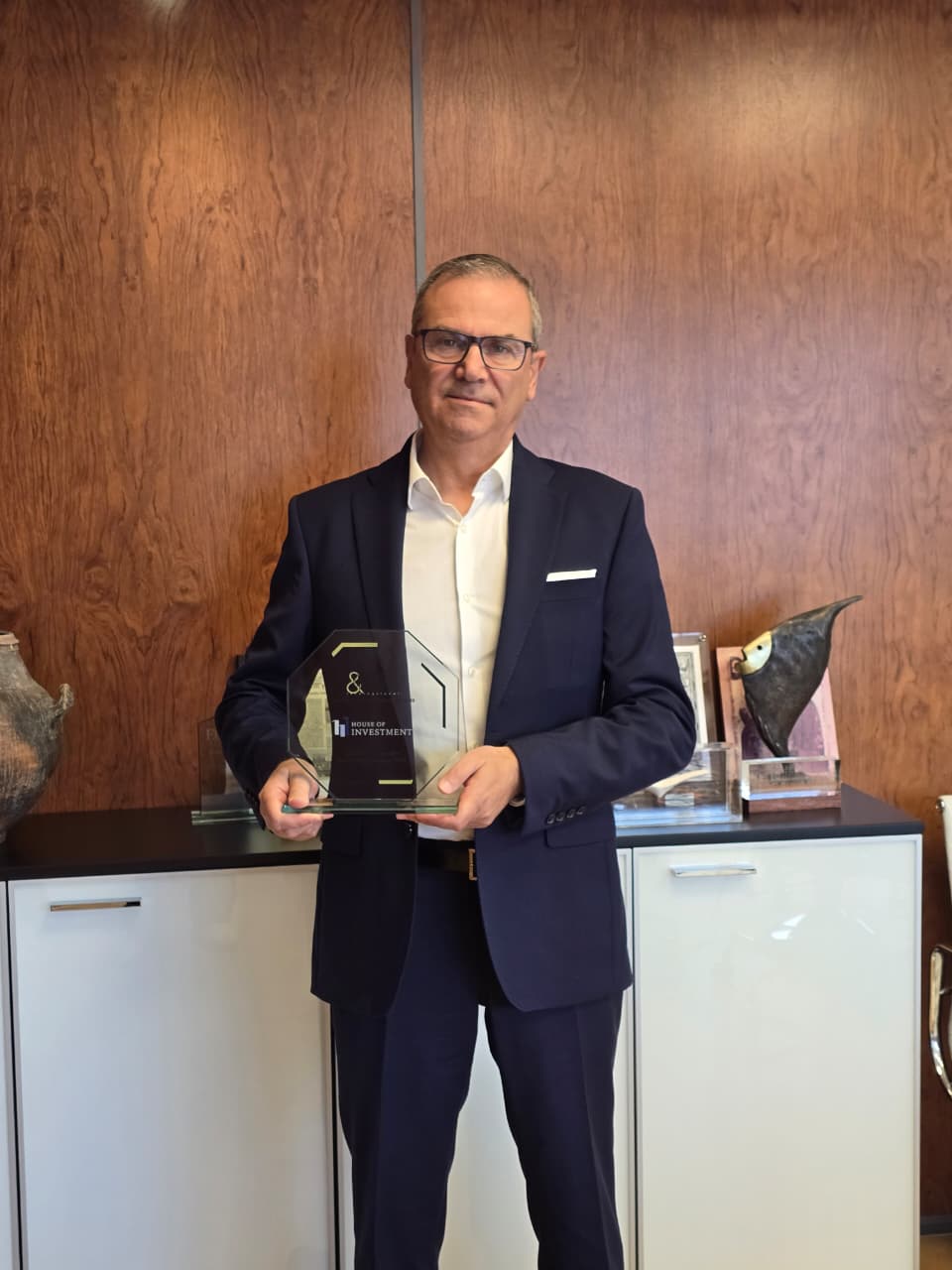 House of Investment with the Investment Excellence Awards 2026 trophy